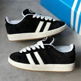 tênis feminino e masculino preto branco