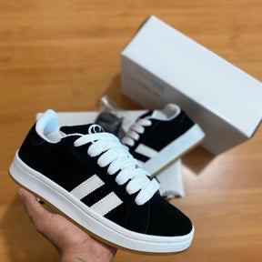 tênis feminino e masculino preto branco